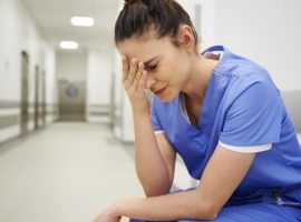 Female nurse suffering from headache